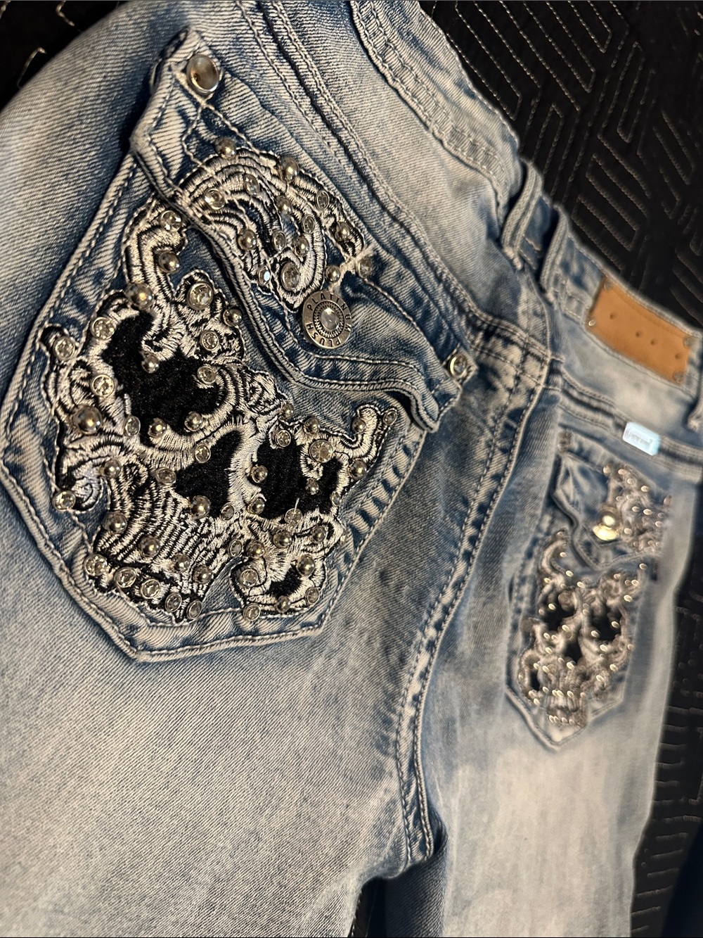 Light wash Miss Me style jeans